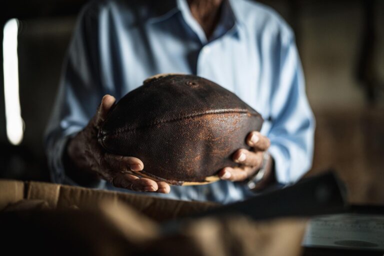 Ansil Saunders holding a football.