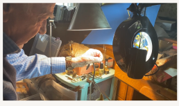 Ted Rogowski ties a fly at his workbench.