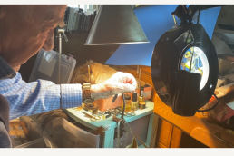 Ted Rogowski ties a fly at his workbench.