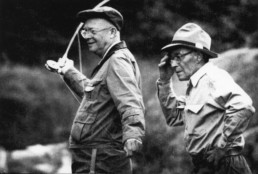 Dwight Eisenhower prepares to cast his rod as guide Don Cameron looks on.