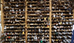 Wooden racks hold the museum's large collection of rods.
