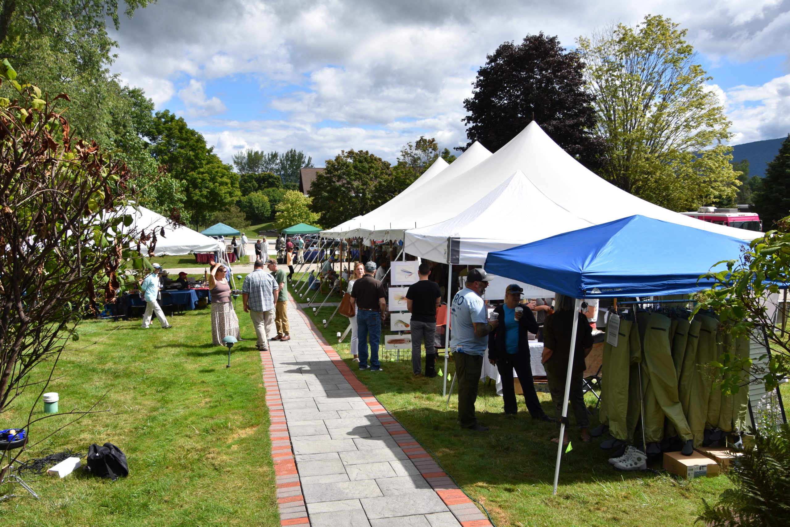 Looking out from the museum's front steps at people wandering through an array of tents both large and small.