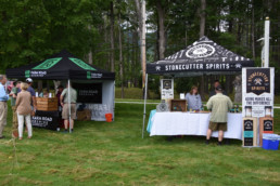 Folks from Farm Road Brewing and Stonecutter Spirits talk to visitors.