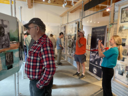 As visitors walk through the newly-opened exhibition honoring Lee and Joan Wulff, Executive Director Sarah Foster shares the experience with Joan via FaceTime.