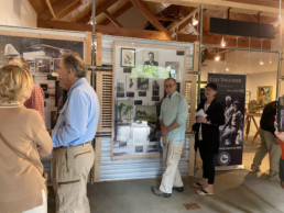 Visitors examine displays panels in the new exhibition dedicated to Lee and Joan Wulff.