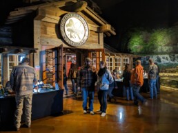 People mill around outside the entrance to the AMFF gallery at the Wonders of Wildlife.